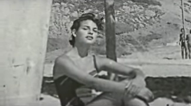 Unknown at the time the lovely Raquel-Welch seeks shade underneath the Windansea Shack